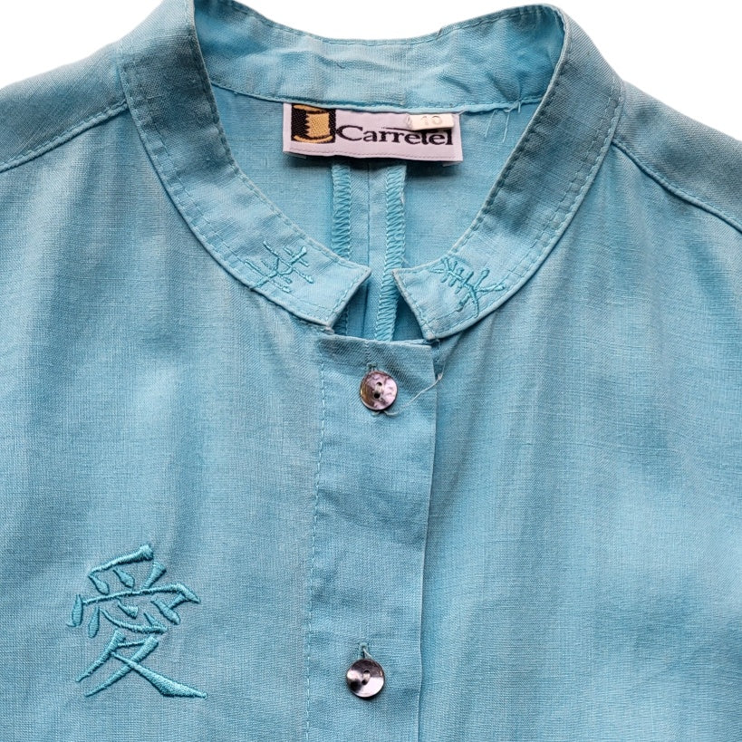 Blusa mujer Carretel Azul con letras chinas bordadas talla 10