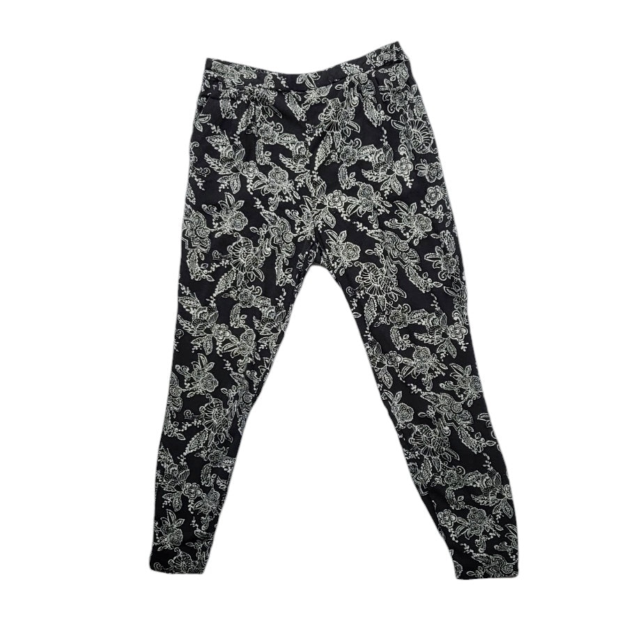 Jogger mujer Sybilla negro con flores blancas talla L